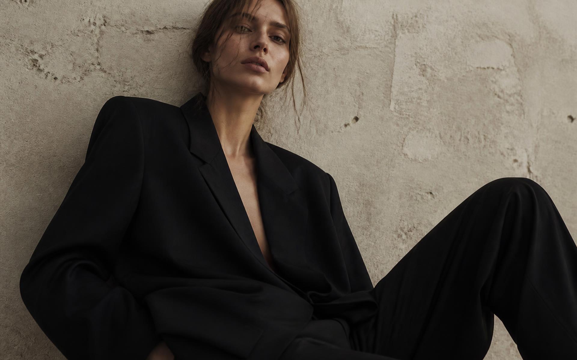 Editorial fashion portrait in minimal black tailoring